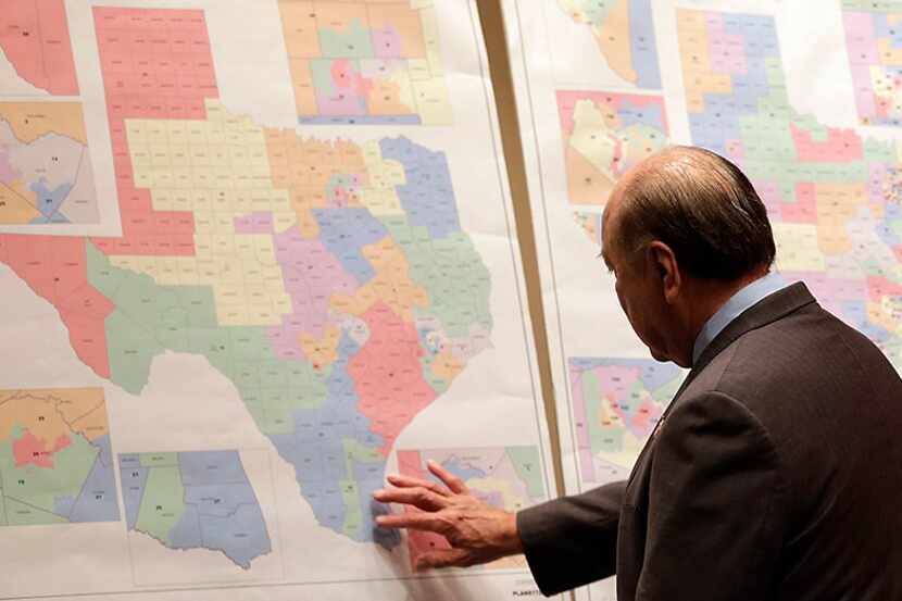 Texas state Sen. Juan "Chuy" Hinojosa looks at maps on display prior to a Senate...