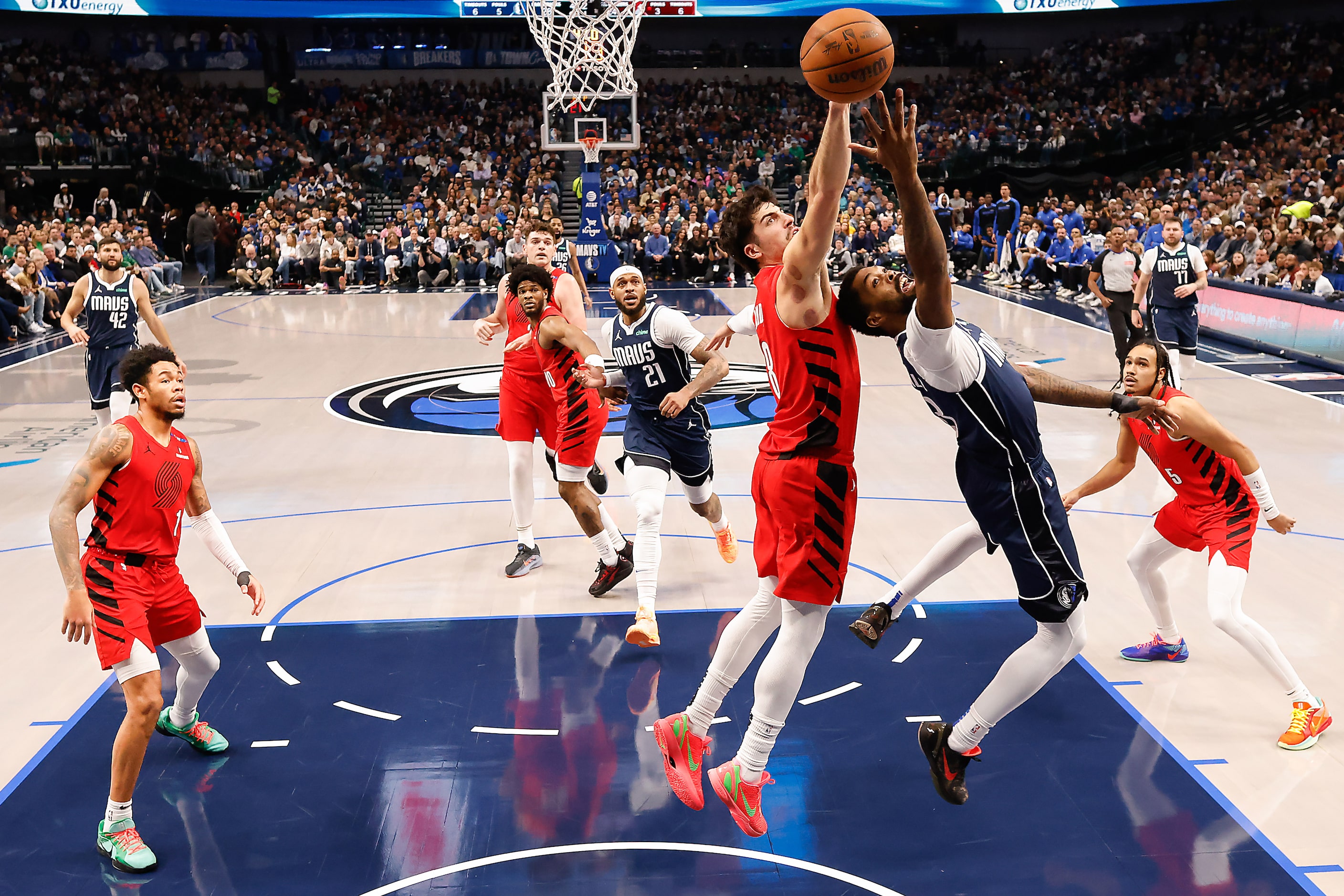 Portland Trail Blazers forward Deni Avdija (8) blocks a shot by Dallas Mavericks forward...