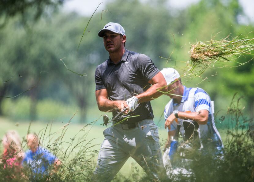 Brooks Koepka hits a ball out of the rough at hole nine during round 1 of the AT&T Byron...