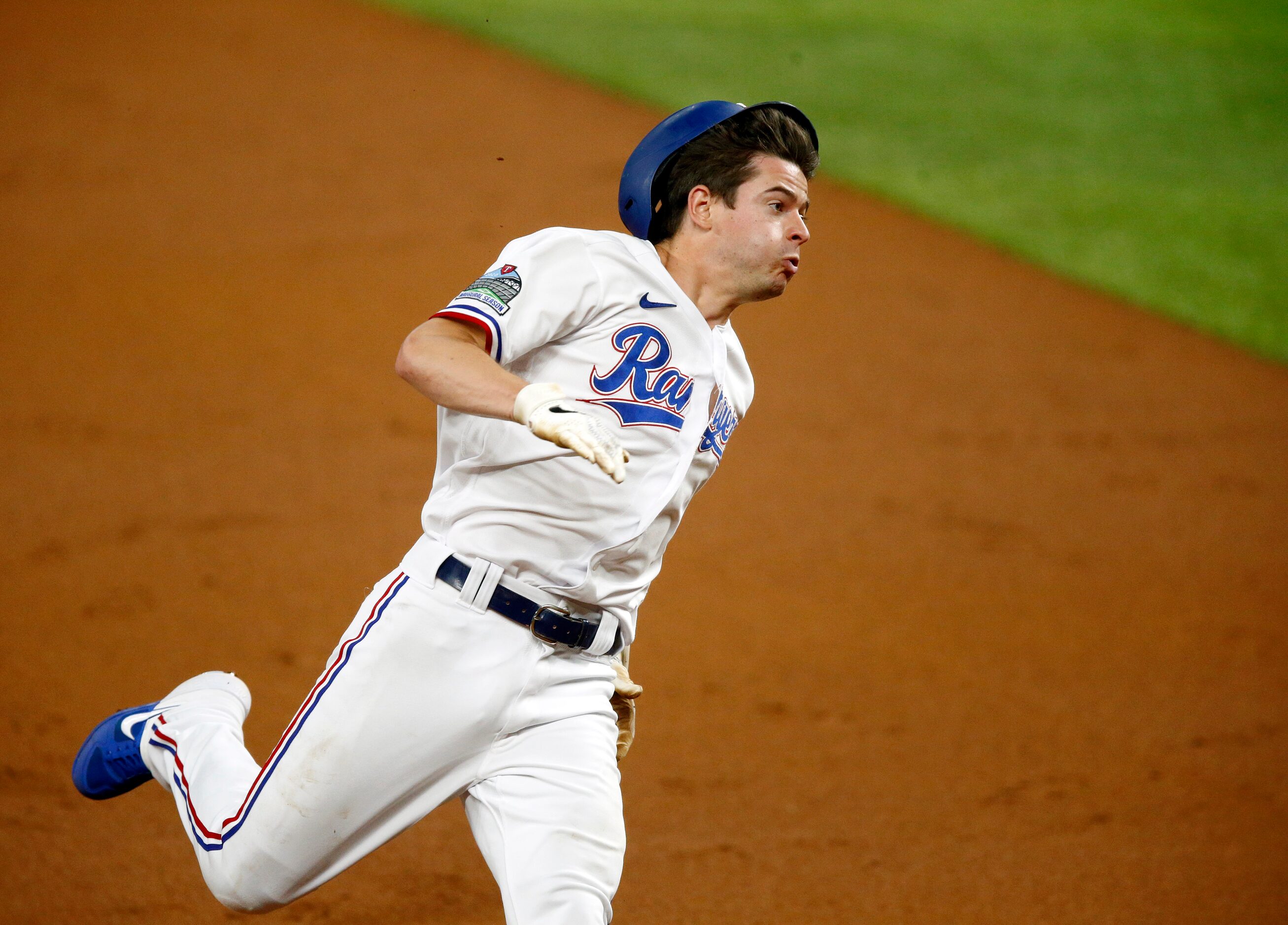 Texas Rangers Nick Solak (15) races to third on a Danny Santana double during the first...