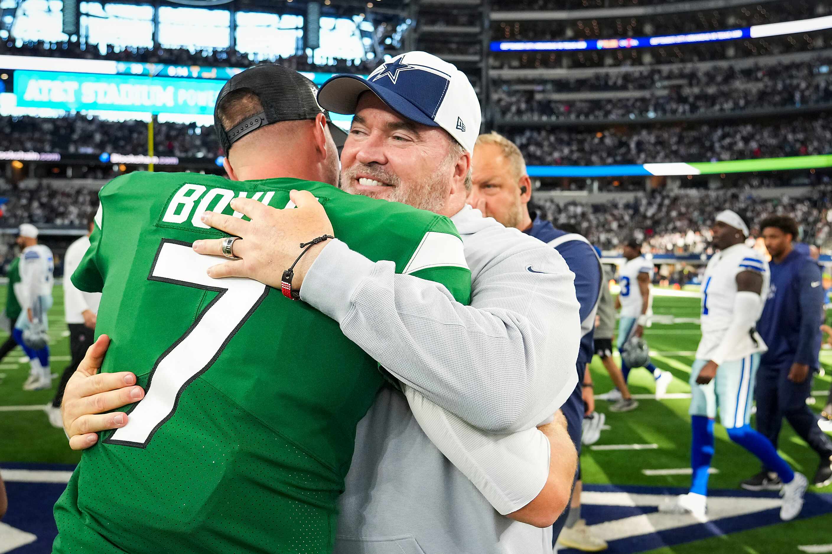Dallas Cowboys head coach Mike McCarthy hugs New York Jets quarterback Tim Boyle  after an...