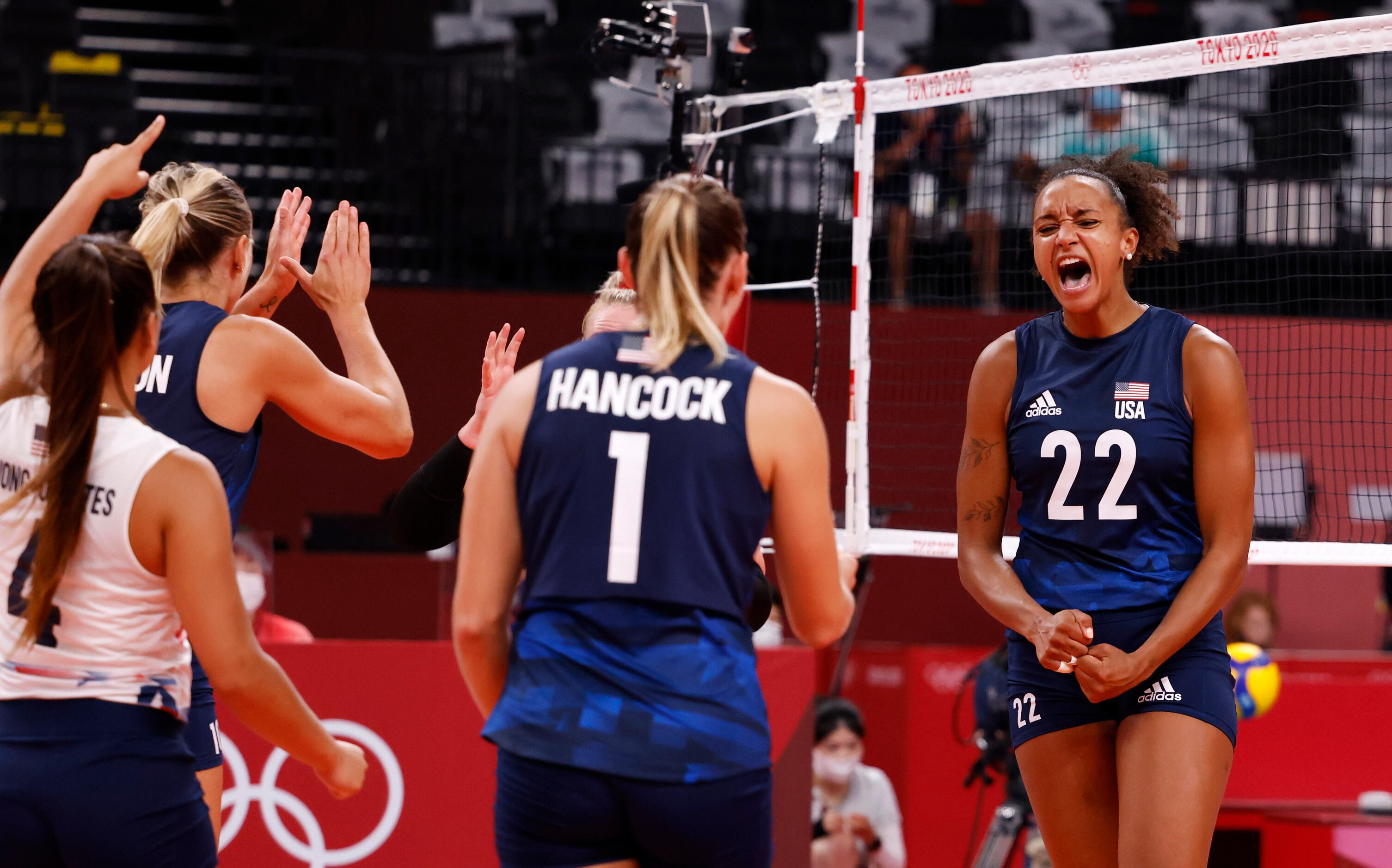 USA’s Haleigh Washington (22) and teammates celebrate after scoring a point against the...