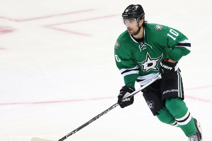 Dallas Stars left wing Patrick Sharp (10) with the puck during the third period of play at...