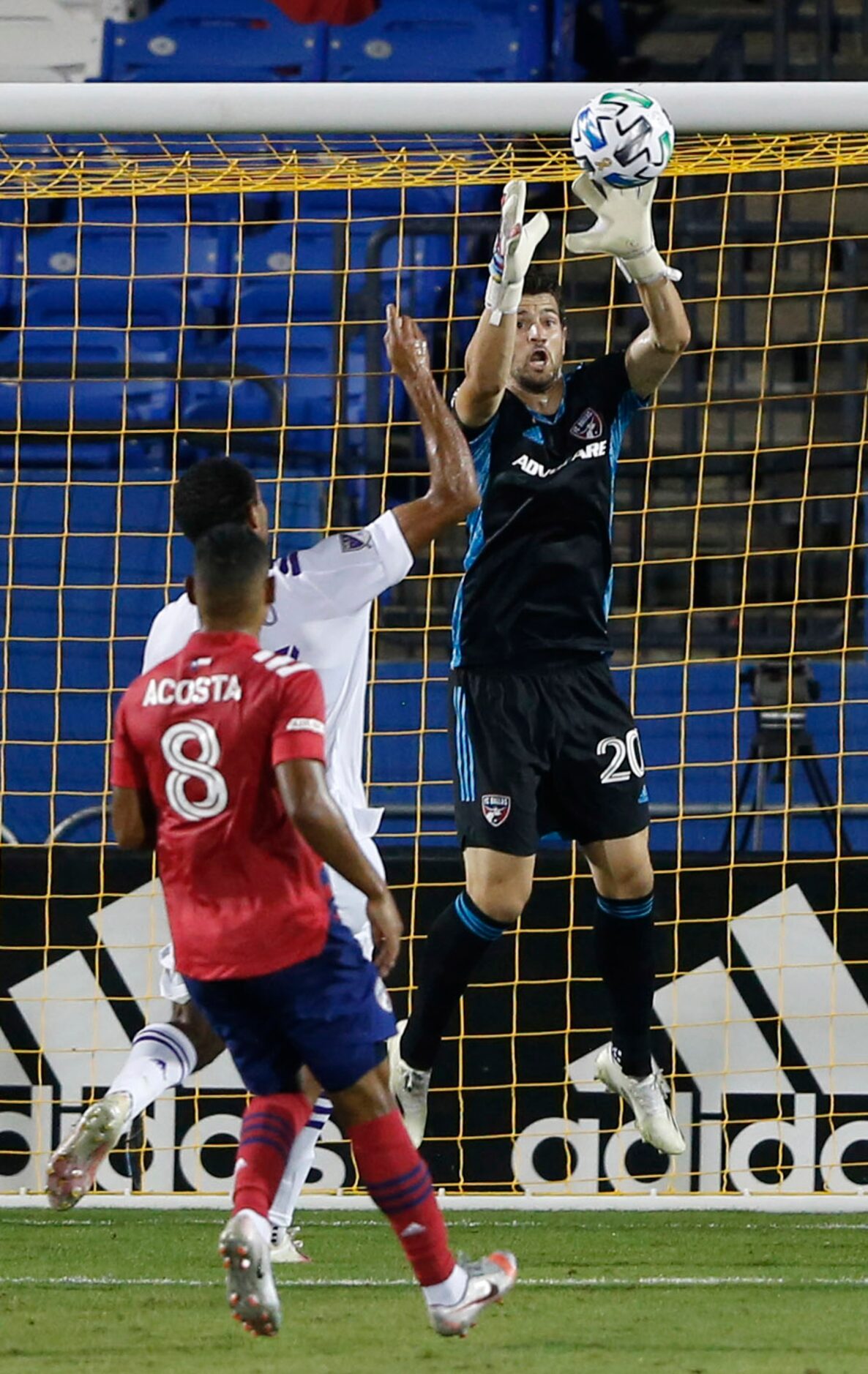 FC Dallas goalkeeper Jimmy Maurer (20) prepares to stop the ball in a game against Orlando...