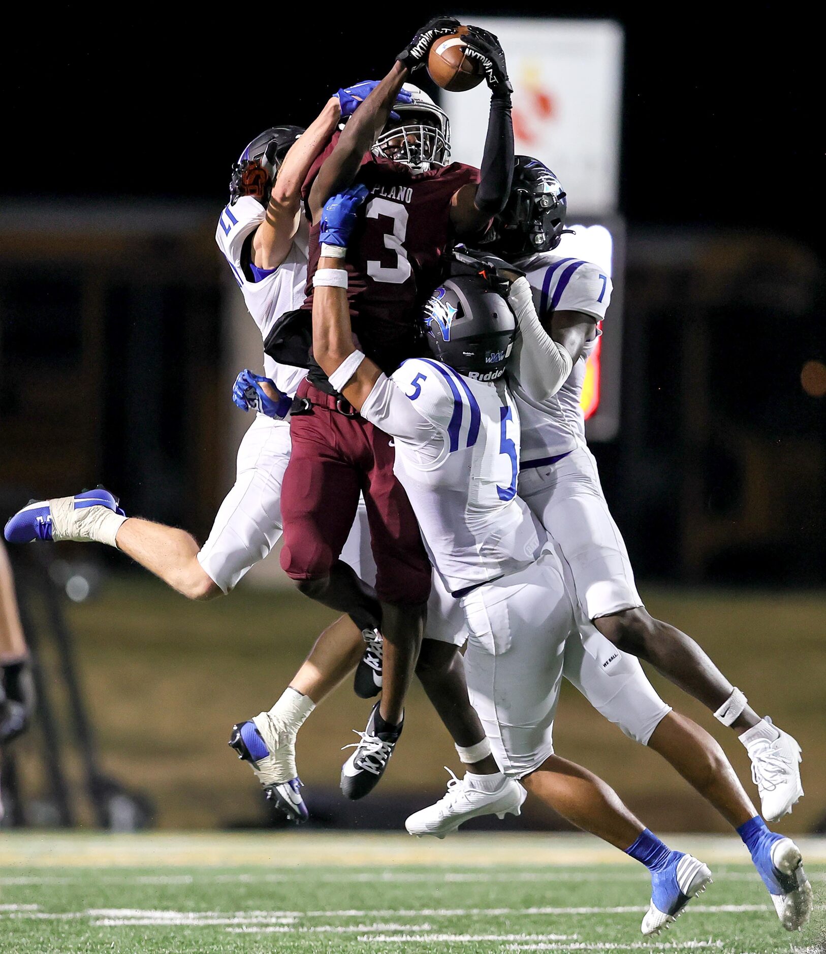 Plano wide receiver DJ Hamilton (3) tries to go up for a reception against Byron Nelson...