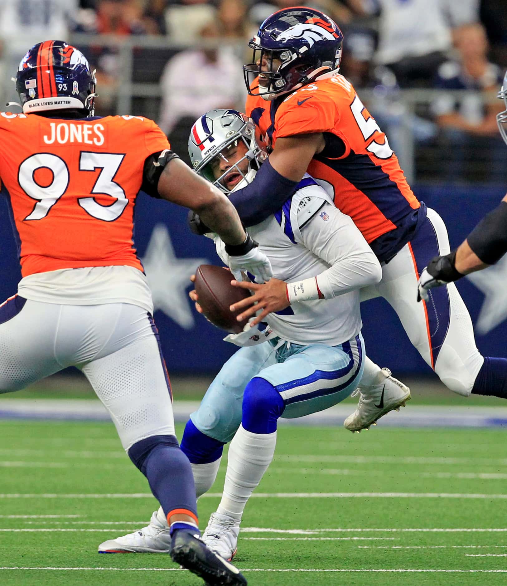 Dallas Cowboys quarterback Dak Prescott (4) is sacked by Denver Broncos linebacker Jonathon...