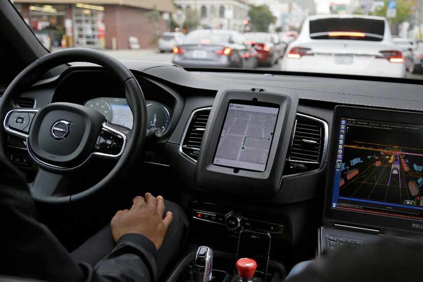An Uber driverless car waits in traffic during a test drive in San Francisco in December 2016.