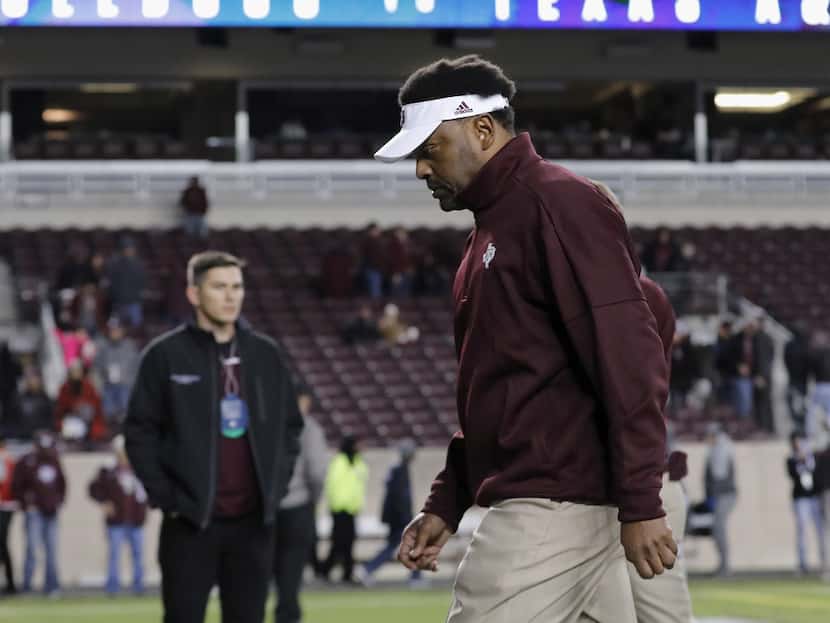 Head coach Kevin Sumlin of the Texas A&M Aggies walks off the field after the game against...
