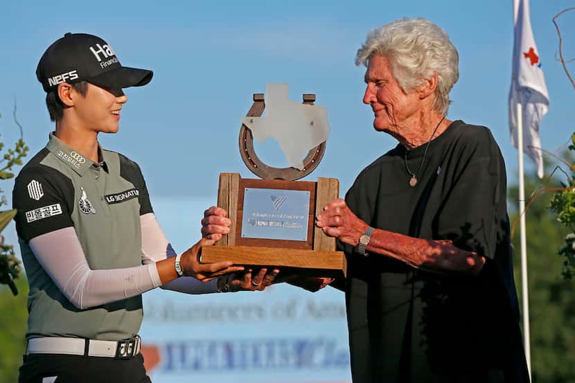 Winner Sung Hyun Park, left, receives the trophy from Kathy Whitworth during Volunteers of...