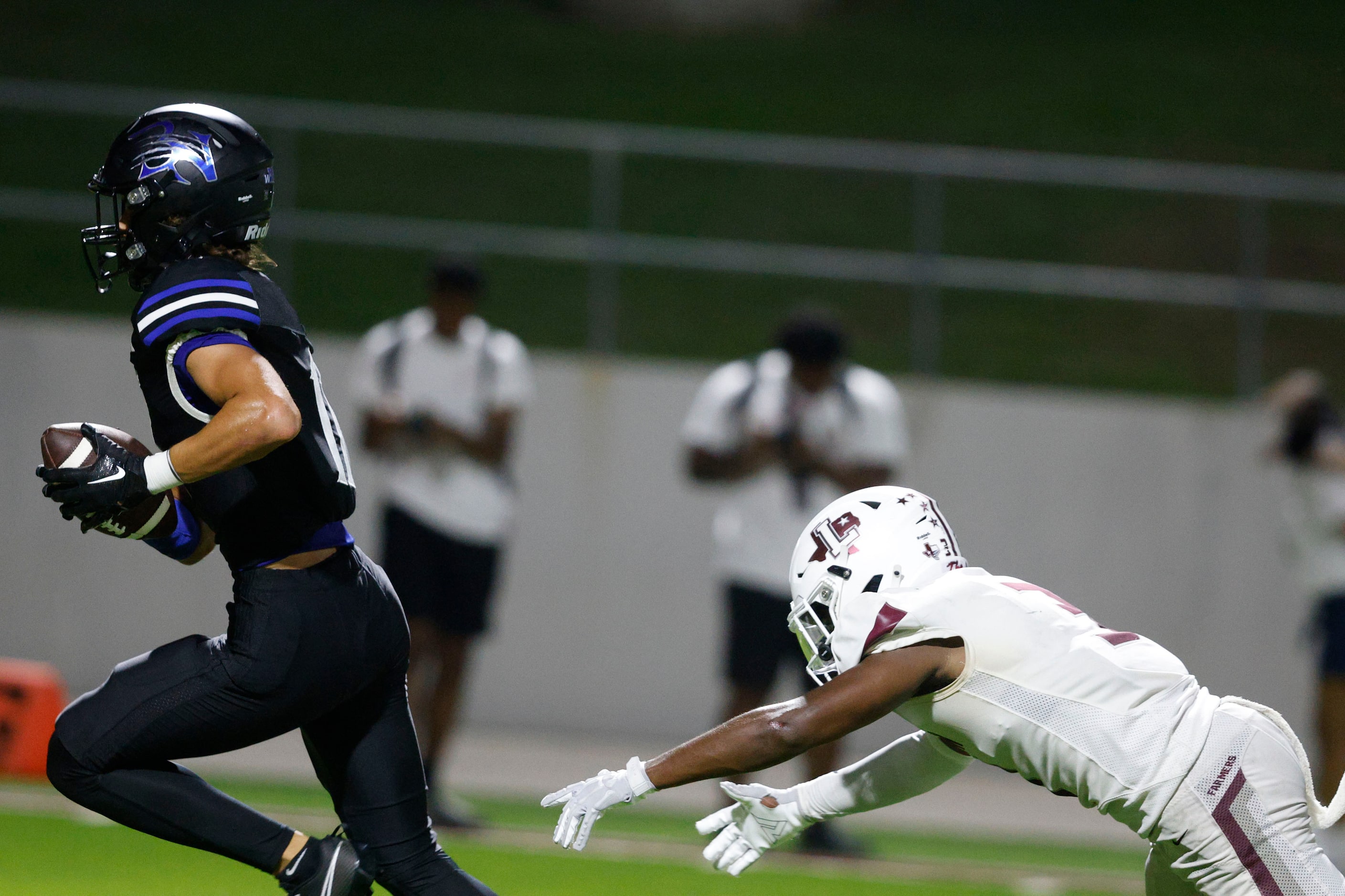 Byron Nelson's Leo Almanza (11) catches the pass and scores against Lewisville's Aiden Evans...