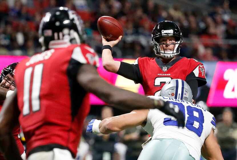 Atlanta Falcons quarterback Matt Ryan (2) throws the ball to wide receiver Julio Jones (11)...