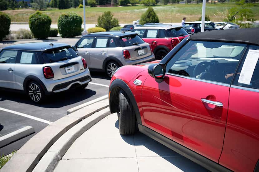 FILE - Used models are shown a Mini dealership on July 21, 2023, in Highlands Ranch, Colo.
