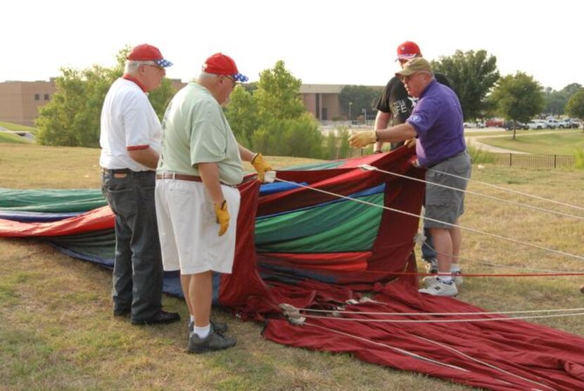 
Cannon instructs (from left) John McGill, Tony Casteel and Pat Davis on their roles in...