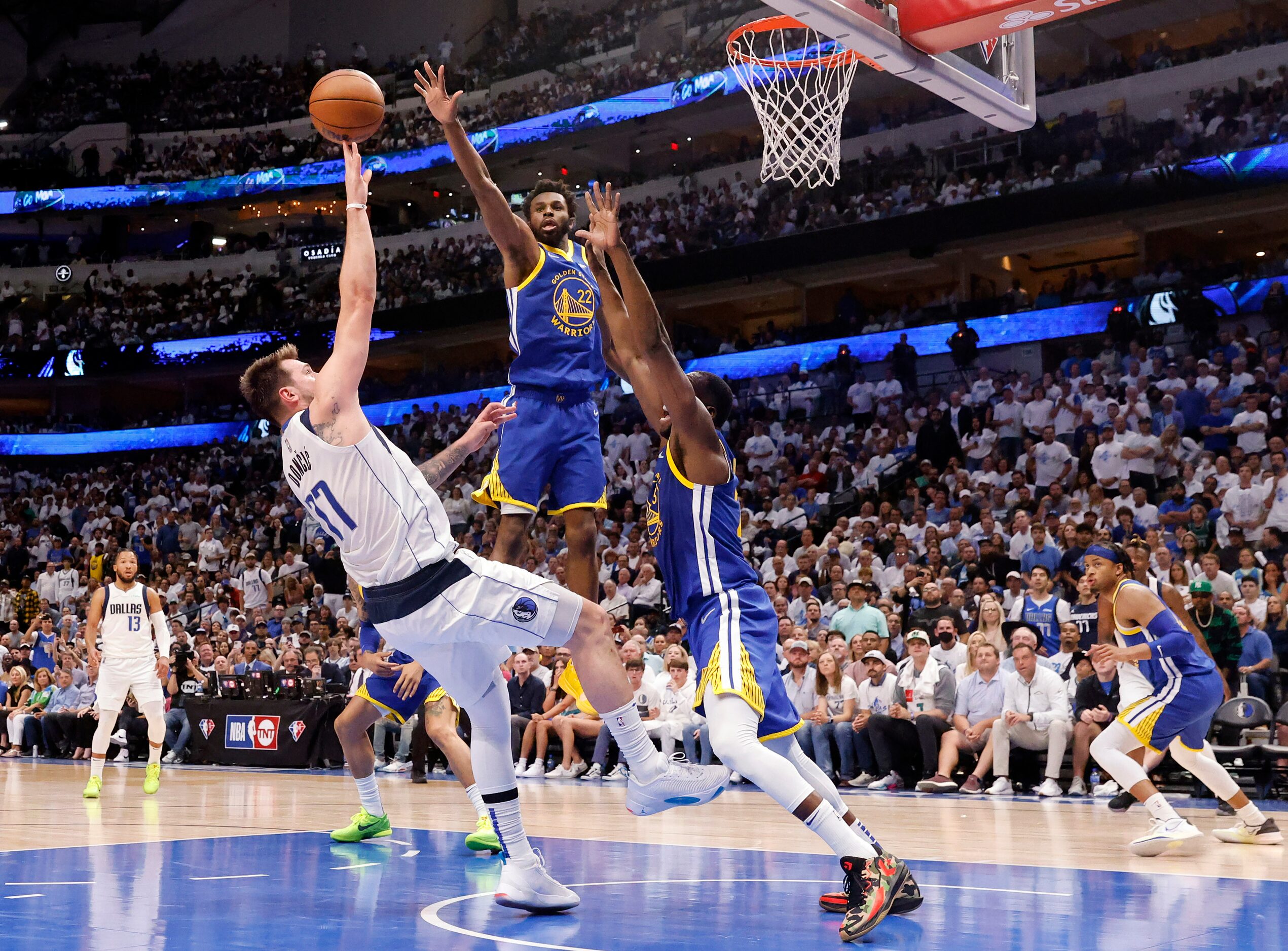 Dallas Mavericks guard Luka Doncic (77) puts up an off-balance shot to end the first half...