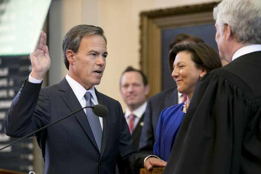  Texas Speaker of the House Joe Straus, left, is sworn in by Texas Supreme Court Chief...