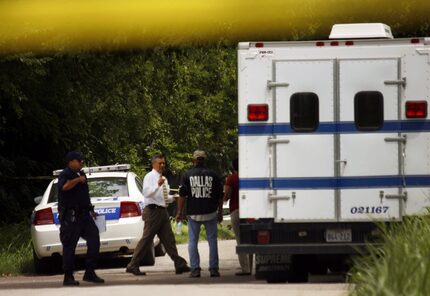 Dallas police search the scene where an officer fired his weapon and struck another officer...