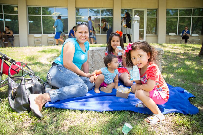 Mother and her children having a picnic