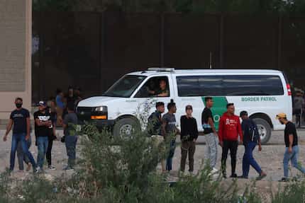 El Paso— Migrants from Venezuela gather on the U.S. side of the Rio Grande after crossing to...