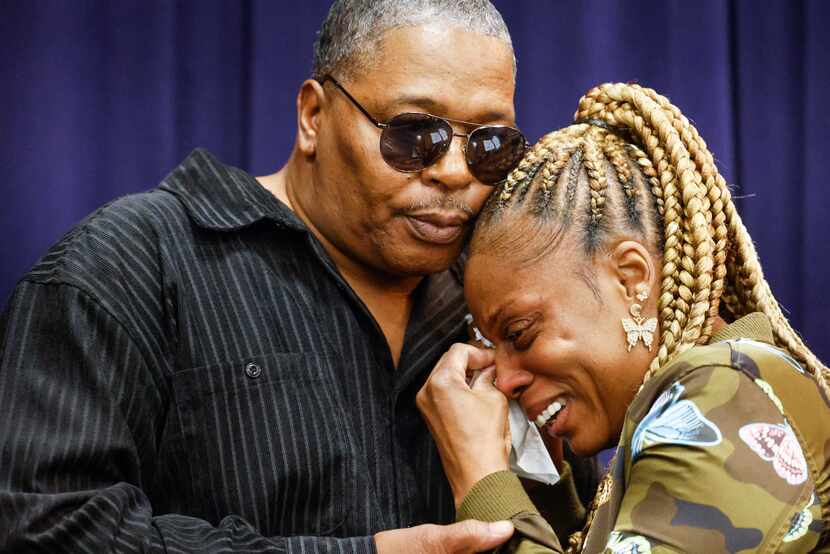 Robert Reese comforts his wife, LaTanya Reese, grandmother of Legend Chappell, after she...