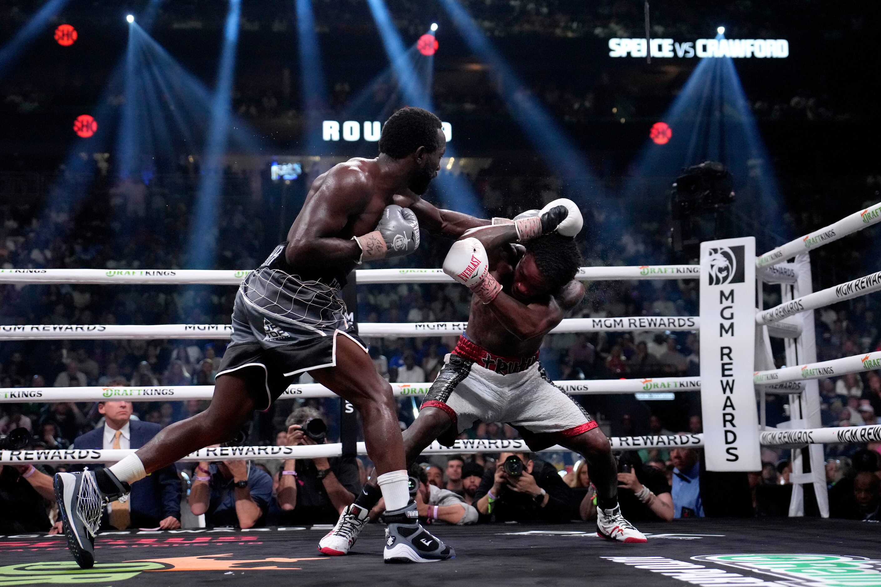 Terence Crawford, left, and Errol Spence Jr. fight during their undisputed welterweight...