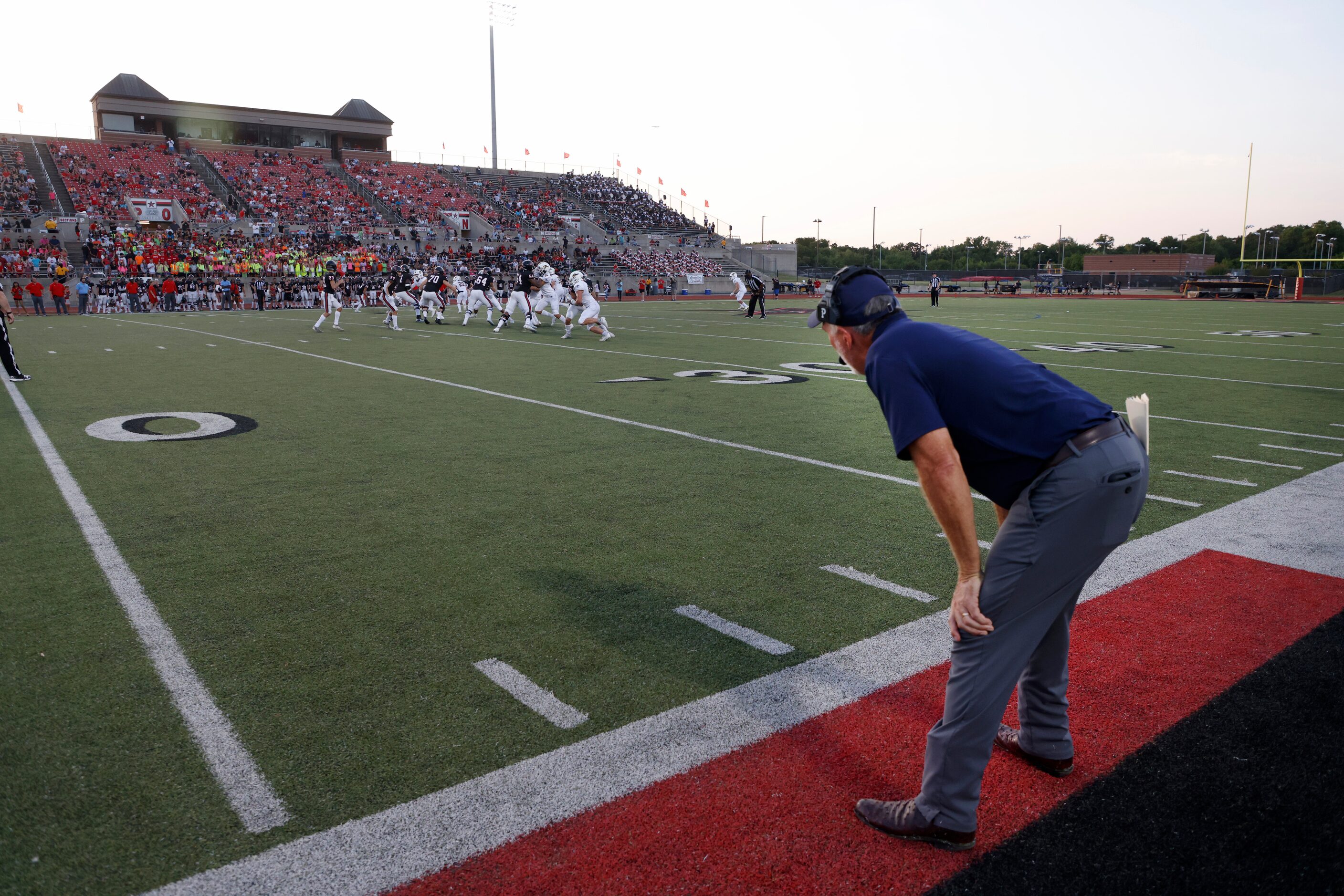 Prestonwood Christian Academy football coach Chris Cunningham watches his team play Coppell...