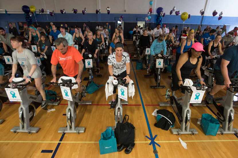 Riders participate in Wheel to Survive, a fundraiser for ovarian cancer research,  at the...
