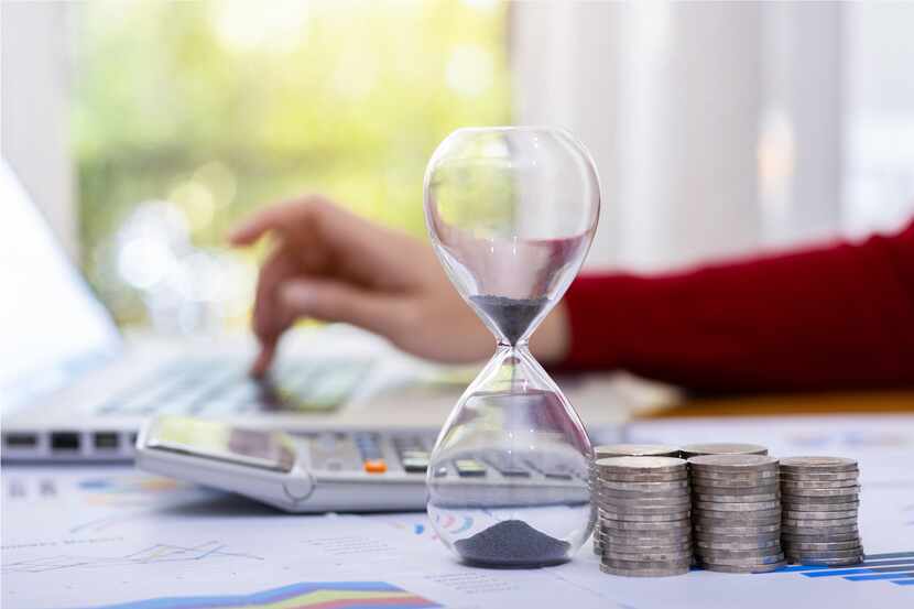 Time management ideas invest ,Money and hourglass,business concept