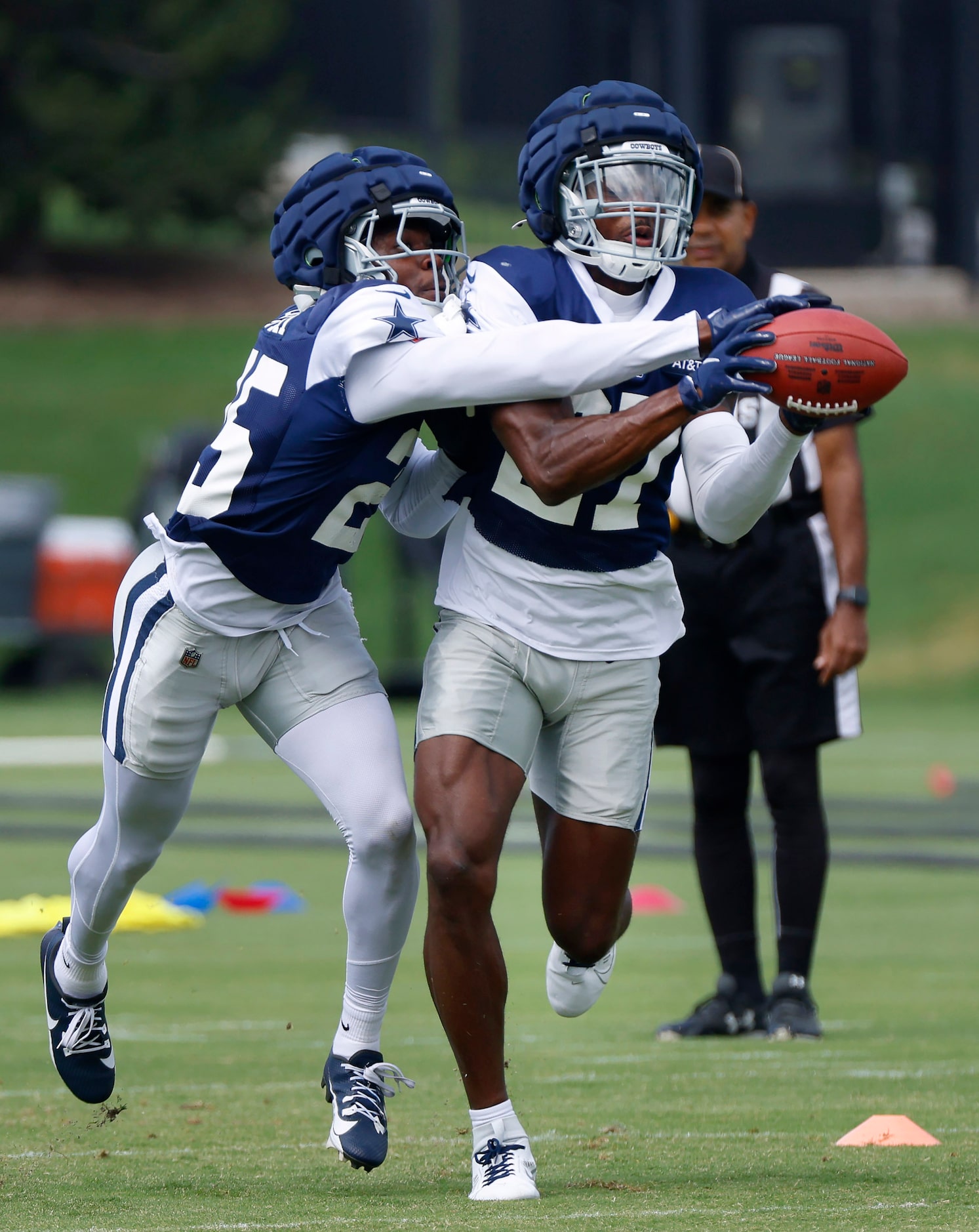 Dallas Cowboys cornerback Amani Oruwariye (27) and cornerback Andrew Booth (25) battle for a...