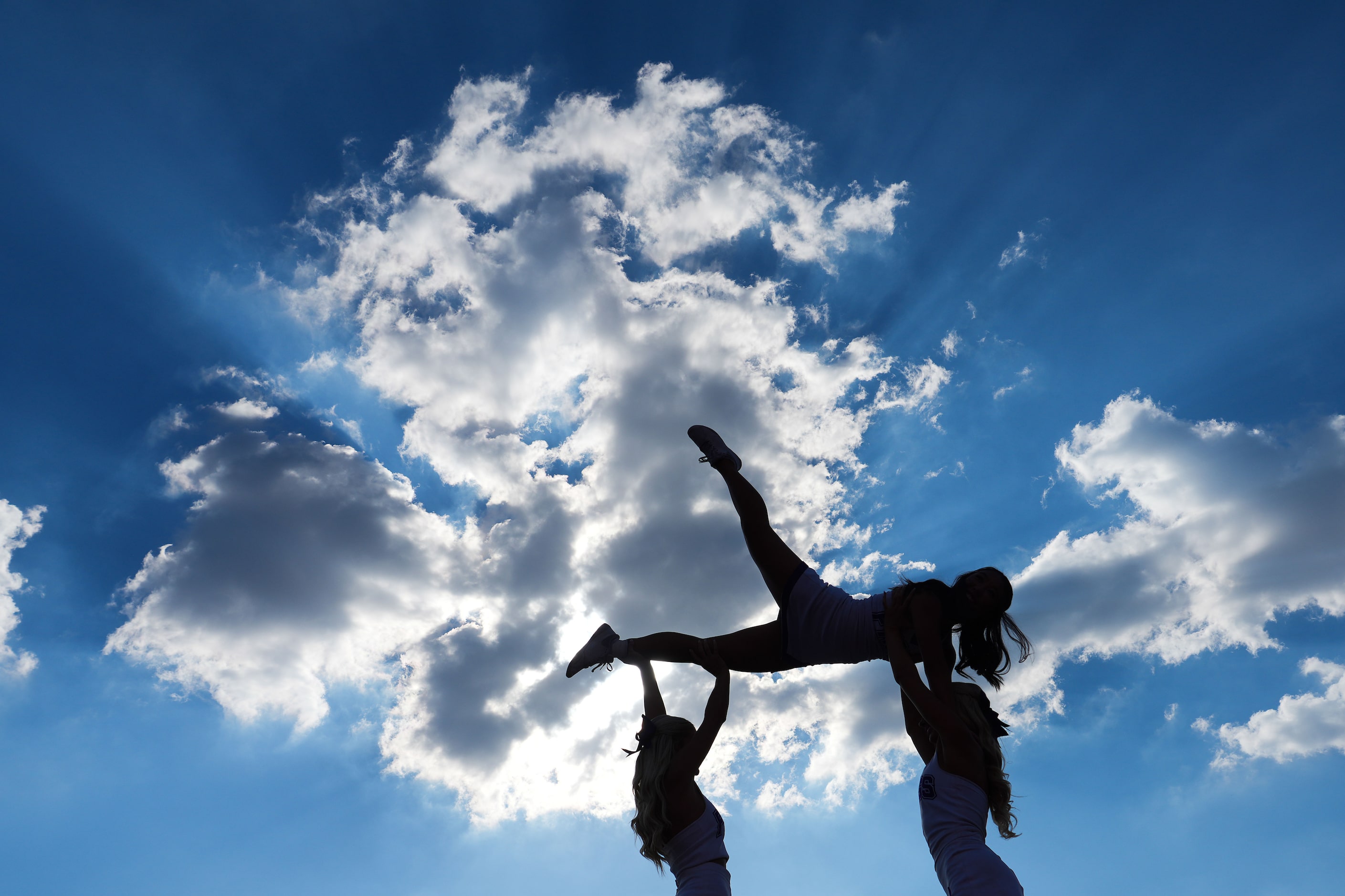 TCU cheerleaders perform during the first half of an NCAA football game against SMU at Ford...