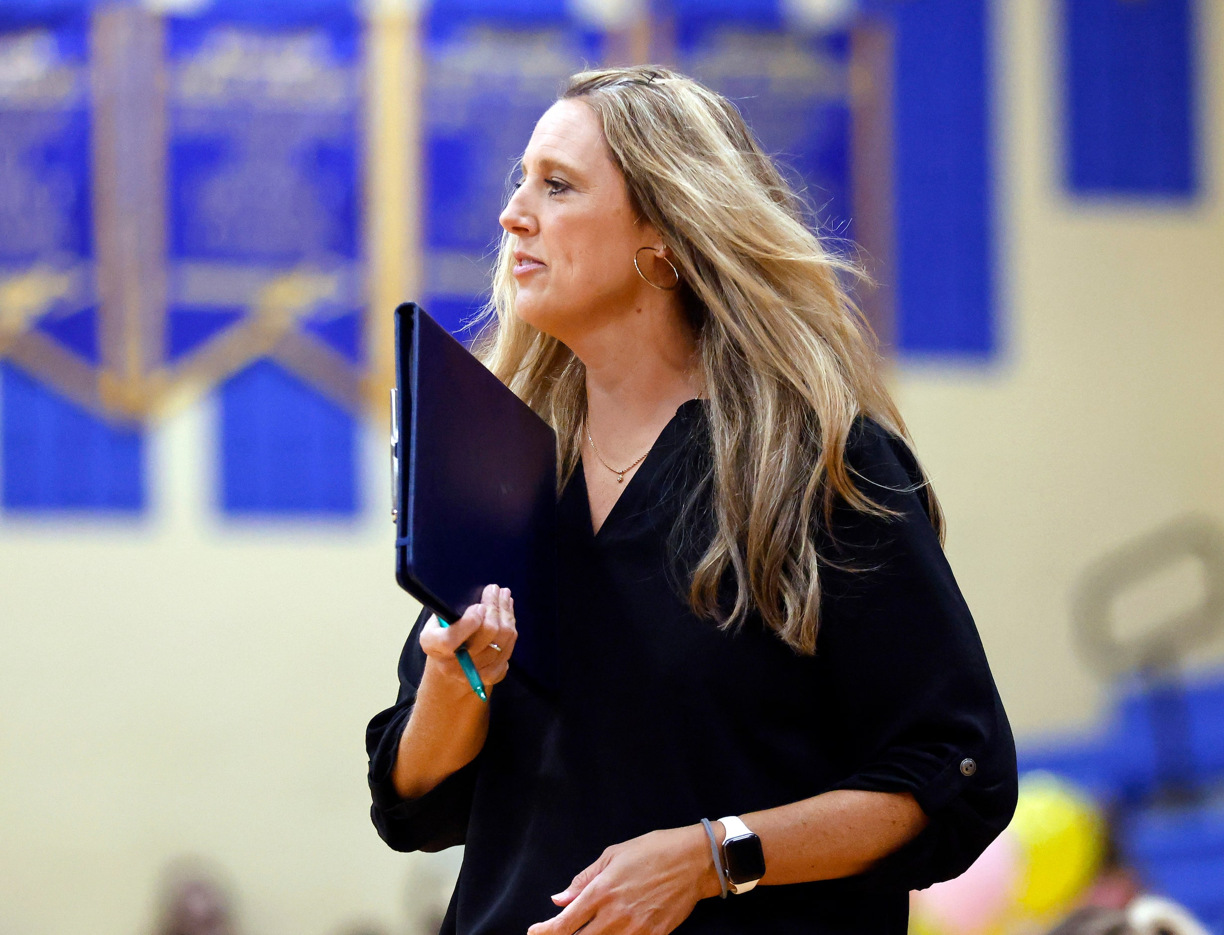 Eaton High head coach Leslie Berens delivers instruction to her team during their volleyball...