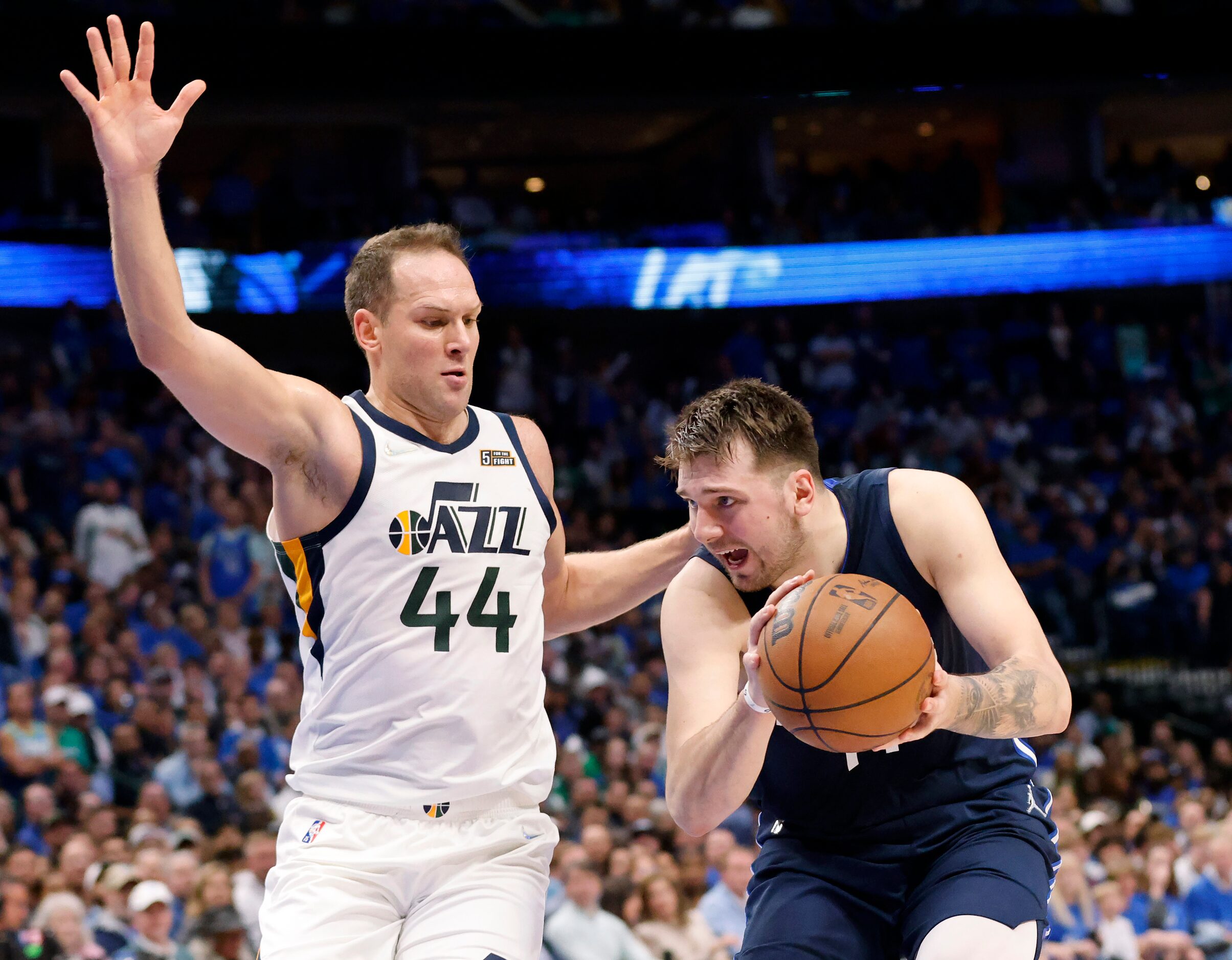 Dallas Mavericks guard Luka Doncic (77) looks to get around Utah Jazz forward Bojan...