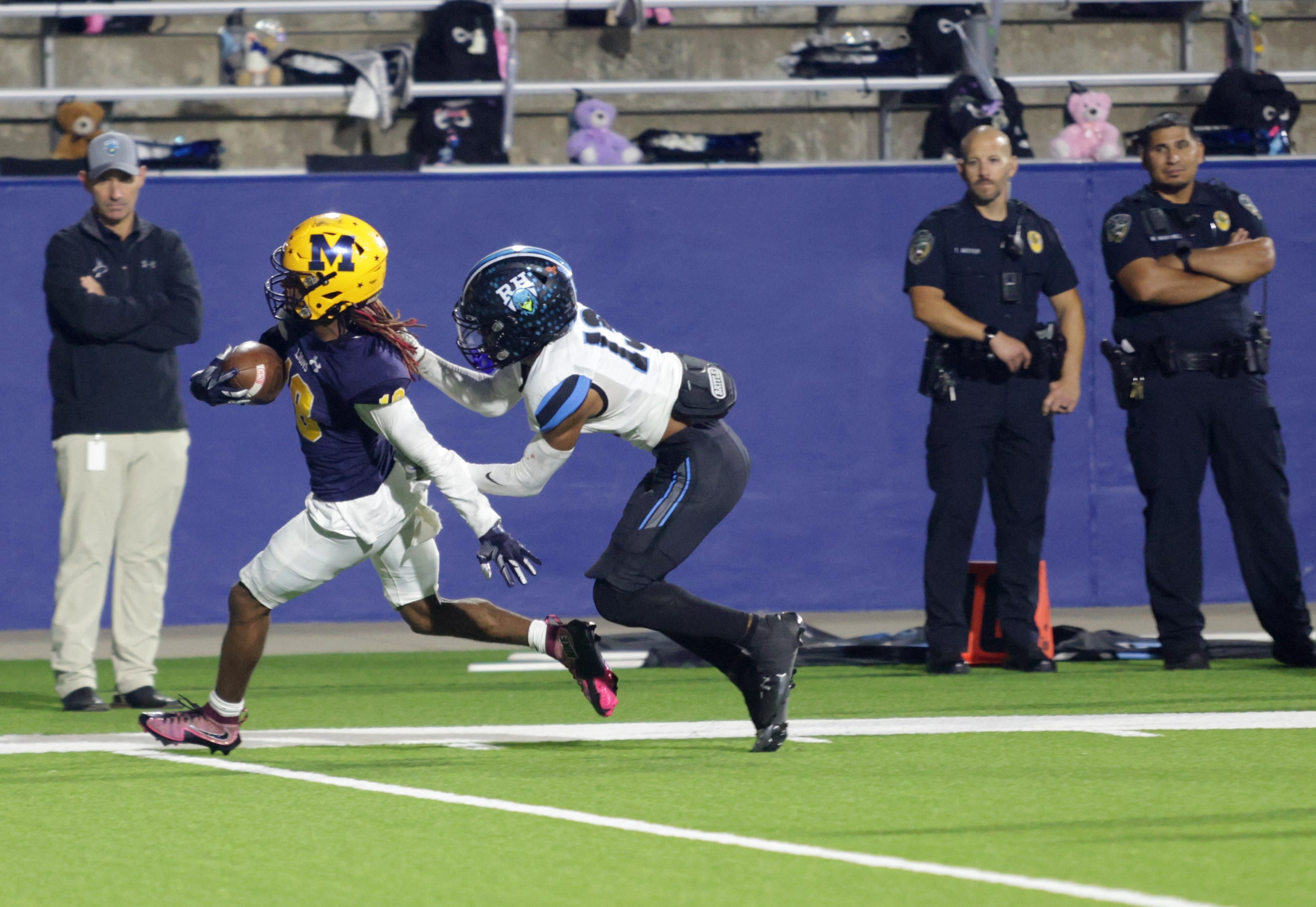 McKinney player #18 Jacoby Propes is stopped by Rock Hill player #13 Donyae Williams after a...