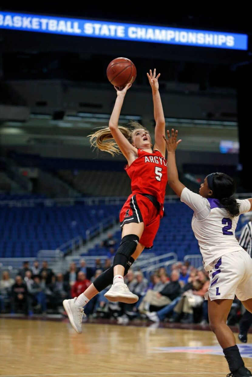 Argyle's Rhyle McKinney shoots in closing seconds and was fouled by Dallas Lincoln's JaMya...