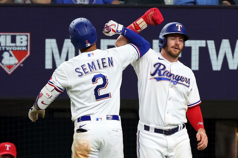 Texas Rangers Marcus Semien (2) celebrates with Robbie Grossman after a two-run home run...