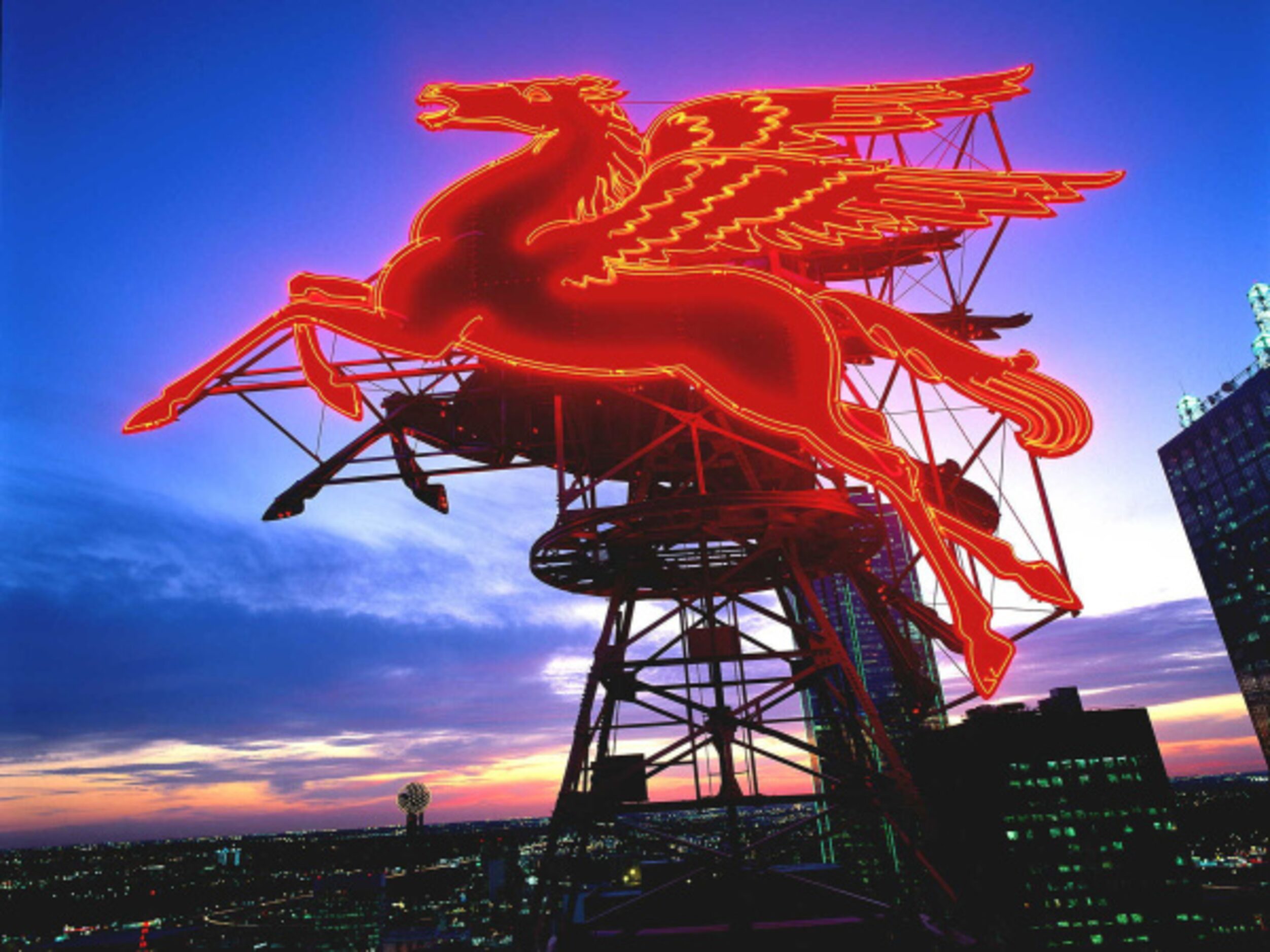 SKYLINE -- The view of the red Pegasus sign atop the Magnolia Building, and Reunion Tower at...