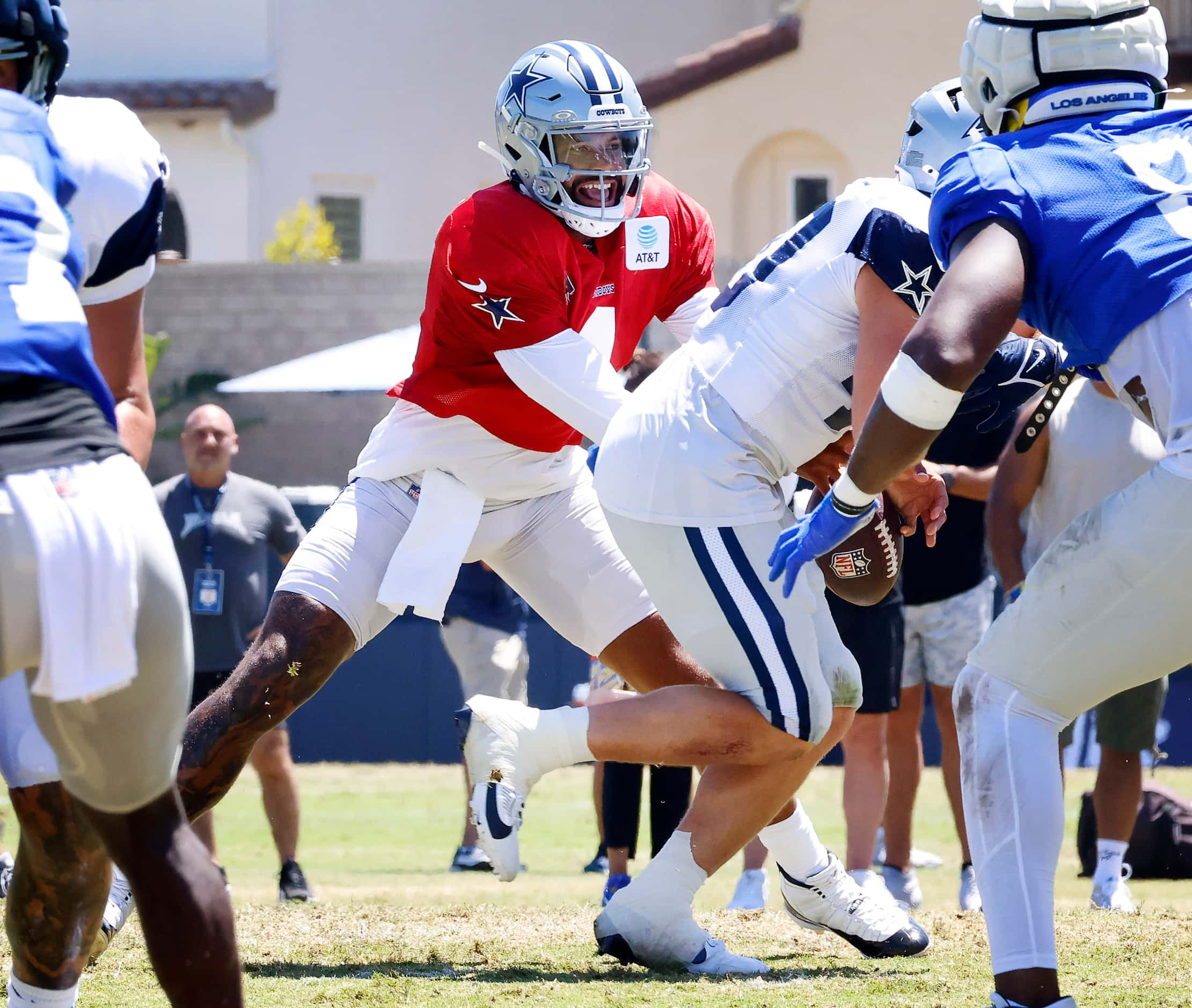 Dallas Cowboys quarterback Dak Prescott (4) misses the handoff to running back Hunter Luepke...