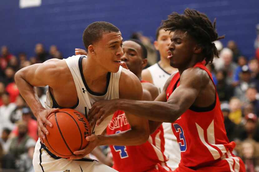 Little Elm's R.J. Hampton (left) tries to get past South Garland's Tyrese Maxey (3) during...