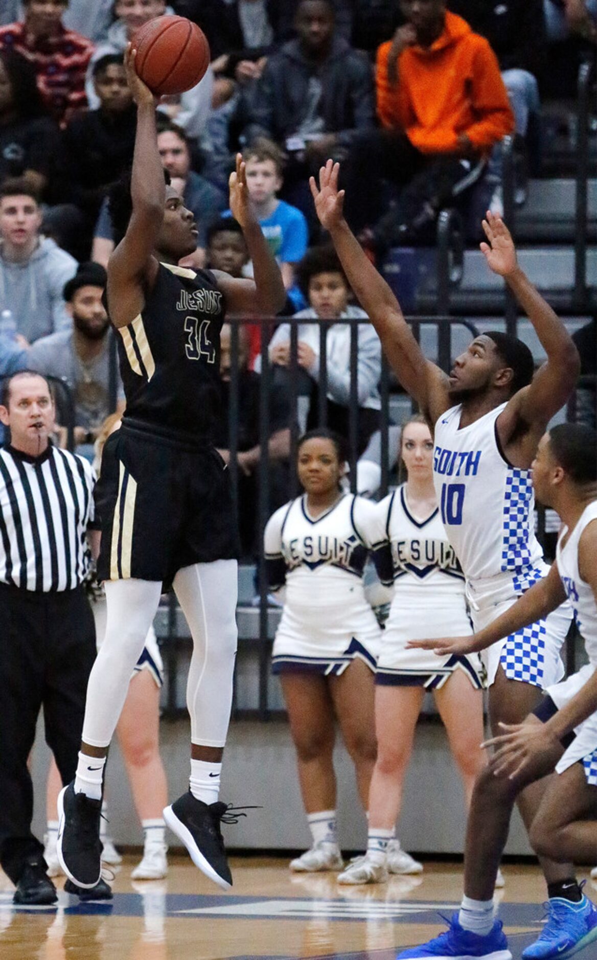 Dallas Jesuit forward Julius Marble (34) puts up a shot during the first half as South...