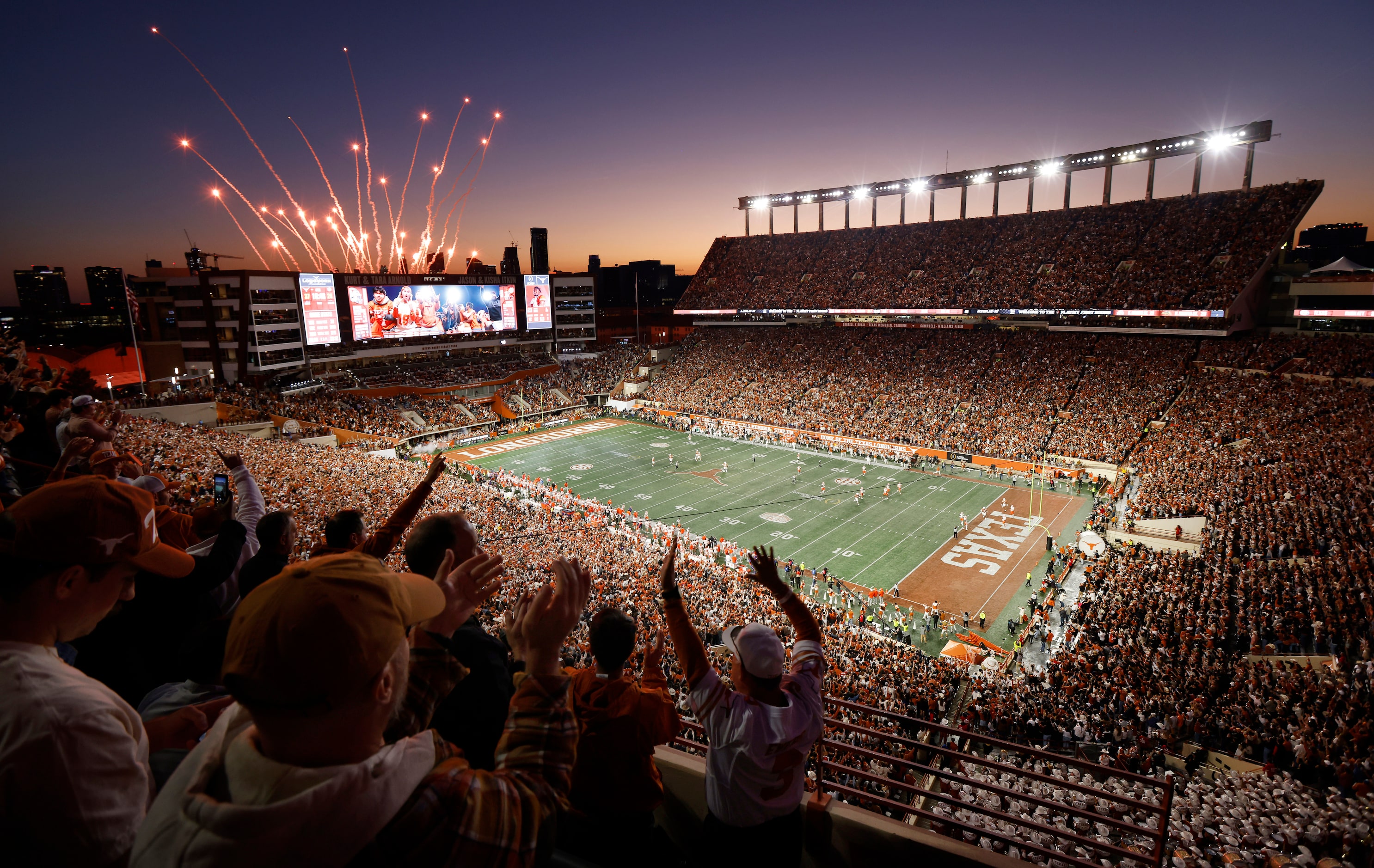 Texas Longhorns fans come to their feet and fireworks explode as running back Jaydon Blue...