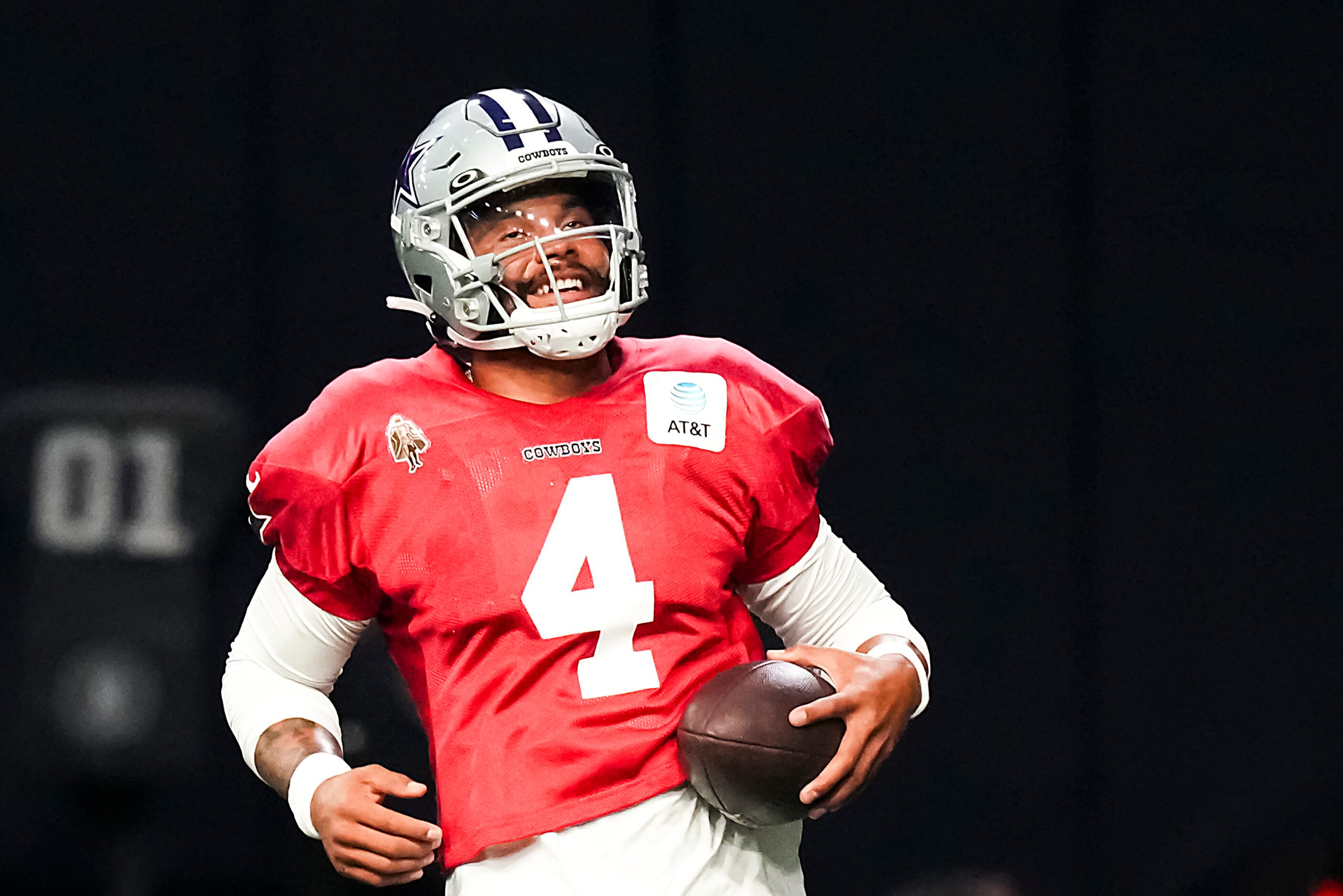 Dallas Cowboys quarterback Dak Prescott (4) runs a drill during the team’s first public...