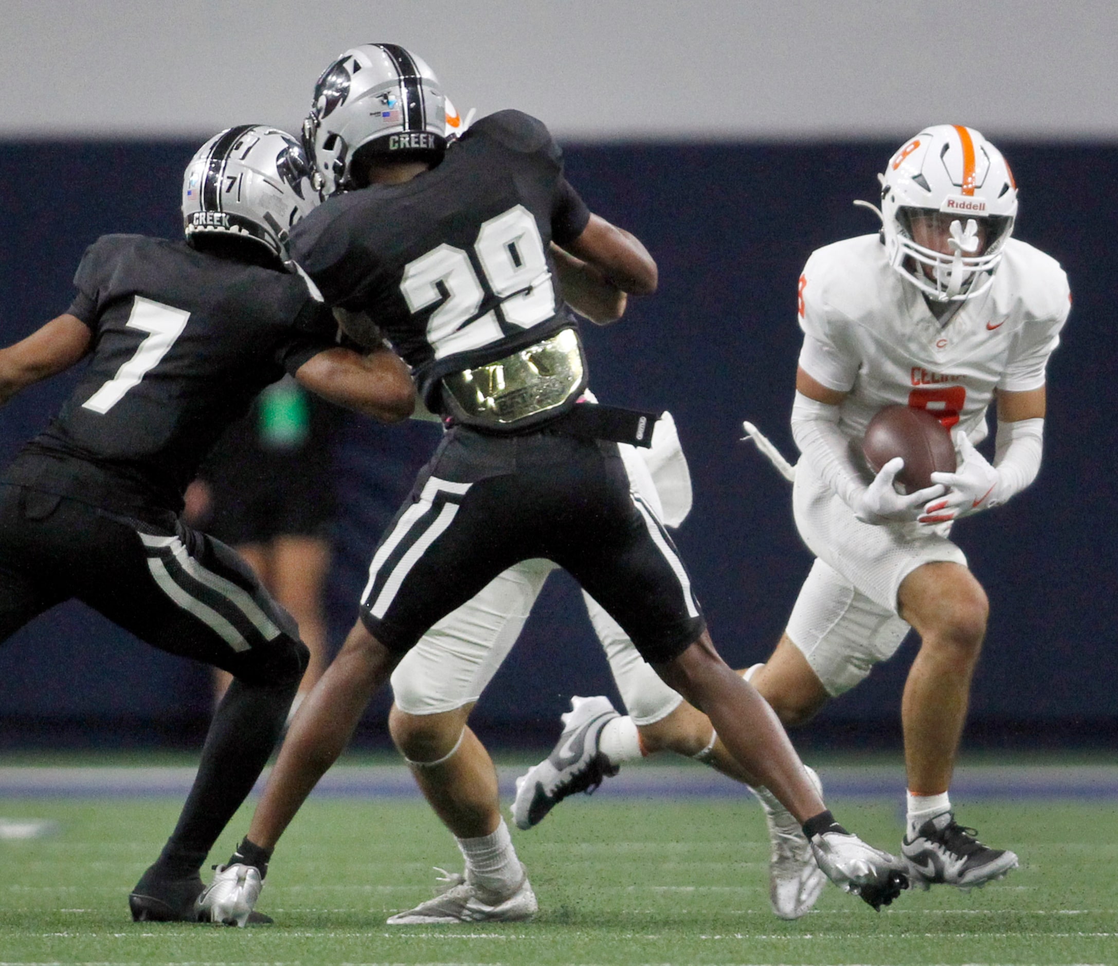 Celina receiver Erick Salinas (8), right, follows his blocks during a first half kickoff...