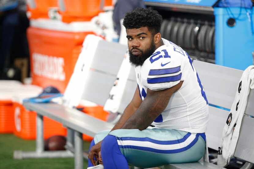 Dallas Cowboys running back Ezekiel Elliott (21) on the bench during the first half of a...