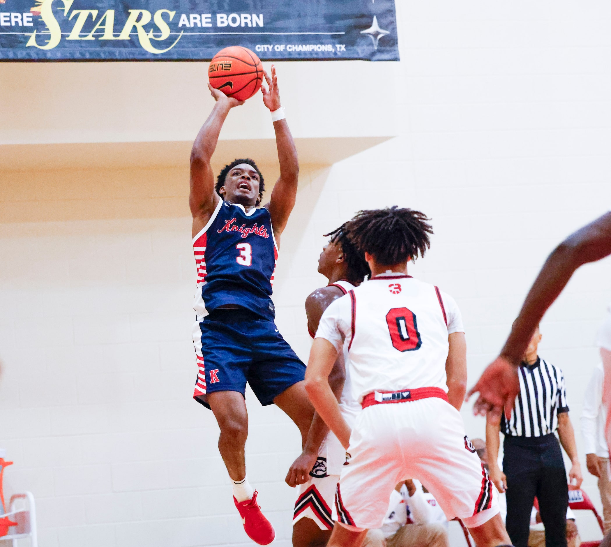 Kimball High’s David Coe shoots against Centennial High of California during the second half...