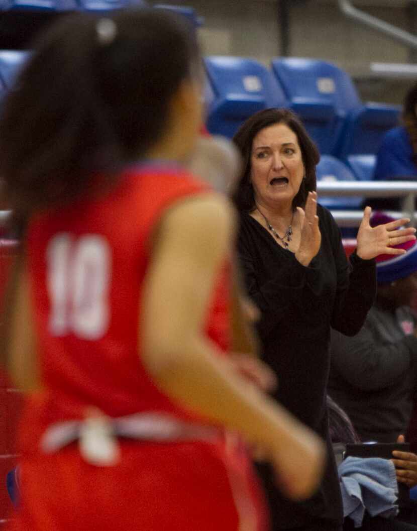 Duncanville head coach Cathy Self-Morgan applauds the play of her team during first half...