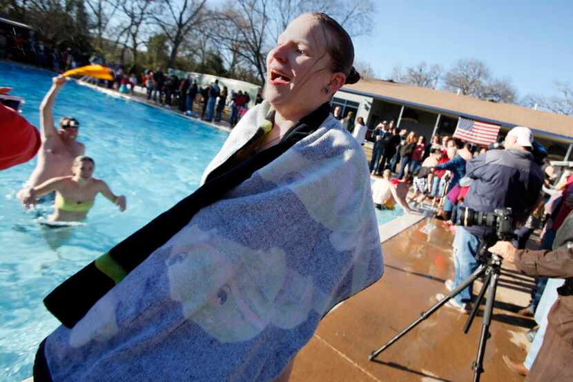 Chrys Creed, 26, of Richardson, reacts as she wraps herself in a towel.