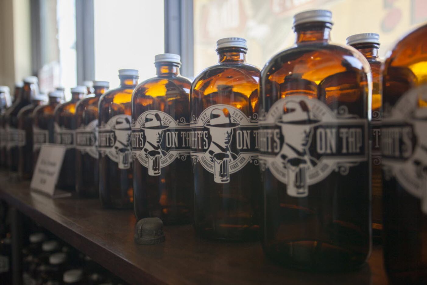 What's On Tap sells growlers to fill up at their taps for customers to take home.