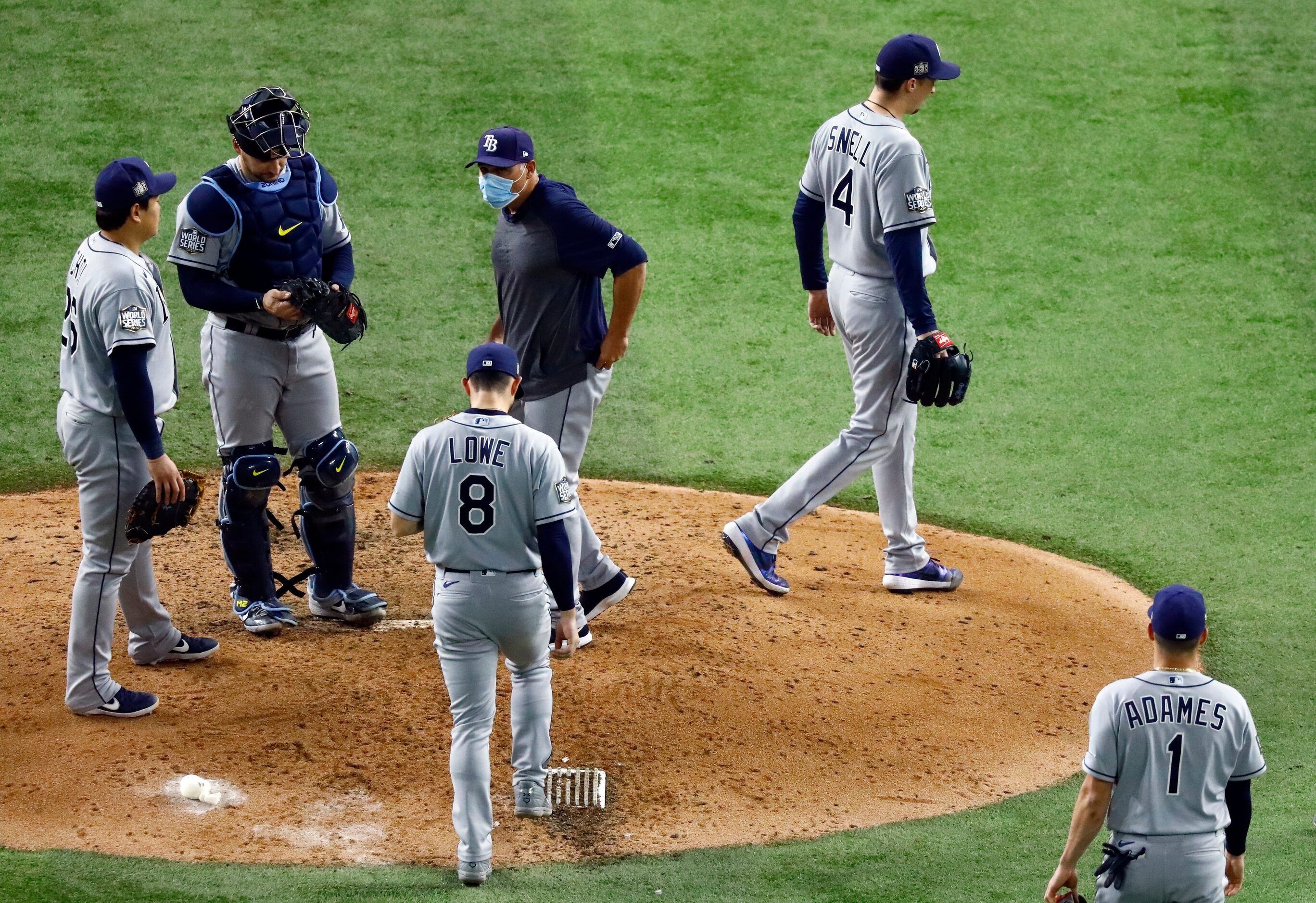 Tampa Bay Rays starting pitcher Blake Snell (4) walks to the dugout after being pulled by...