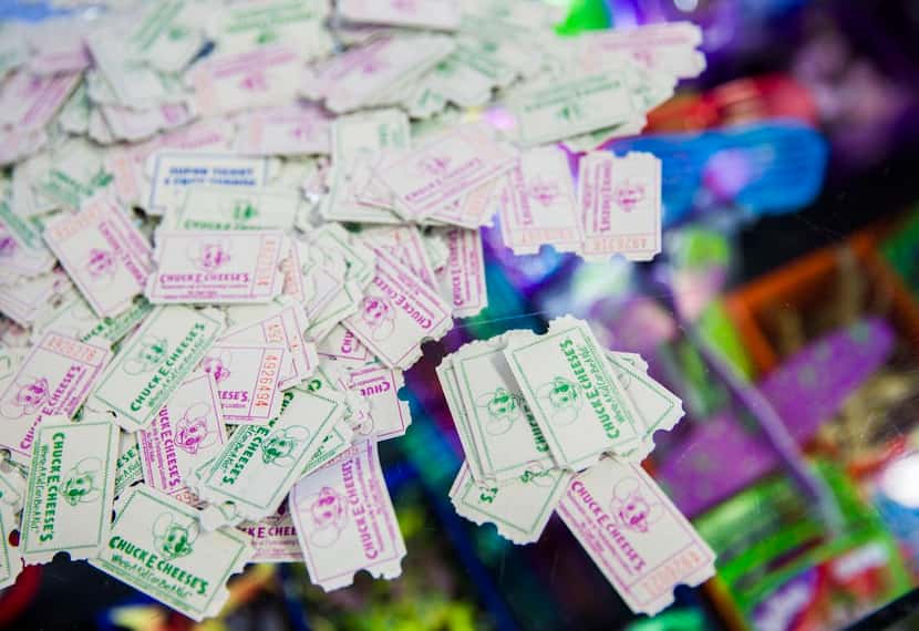 
Tickets awarded for arcade games sit on a counter at Chuck E Cheese on Wednesday, April 8,...