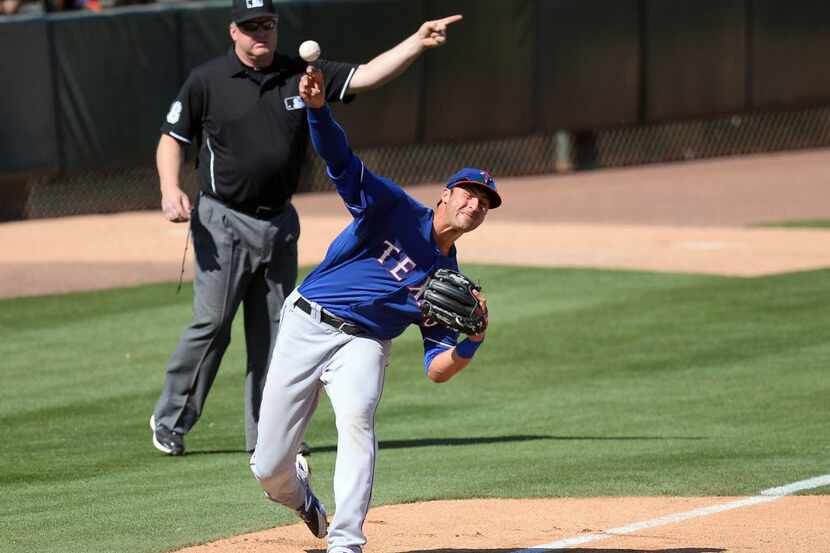 Mar 15, 2014; Phoenix, AZ, USA; Texas Rangers third baseman Joey Gallo (33) throws to first...