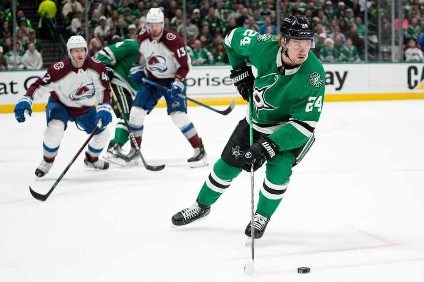 Dallas Stars center Roope Hintz (24) looks to make a pass on an attack as Colorado...